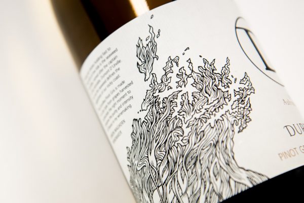 Close up detail of a wine bottle with label design by Wellington agency Wonderlab.