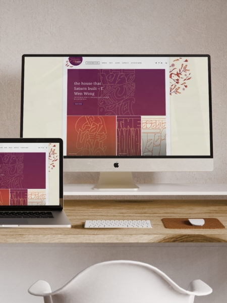 Two laptops displaying a typography based website design by Wonderlab.