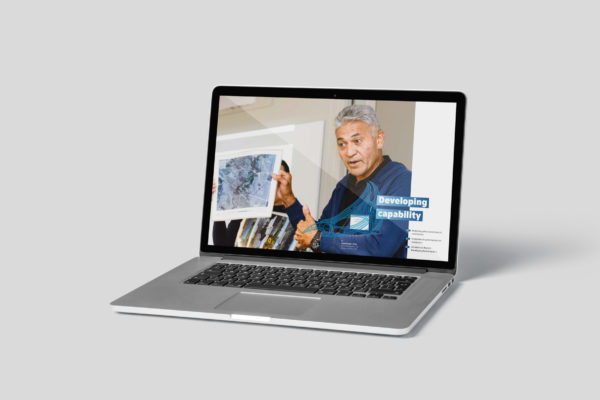 Laptop displaying digital annual report created by digital designers Wonderlab.
