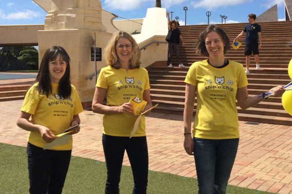 Women wearing branded yellow t-shirts at a public engagement event designed by Wonderlab