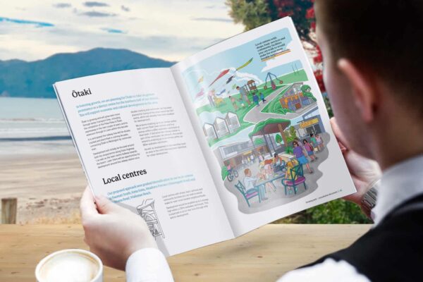 Person reading an illustrated booklet designed by communication designers Wonderlab.