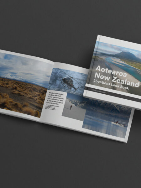 A new zealand travel brochure on a black background.
