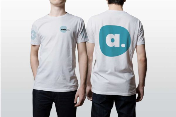 Two models wearing corporate T-shirt branding by Wellington design agency Wonderlab
