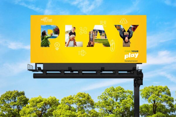 Billboard with the words PLAY, part of a design presentation by Wonderlab.