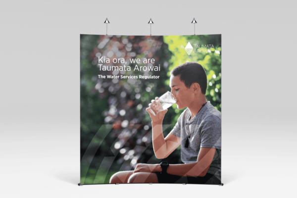 A poster with a boy drinking water from a glass.