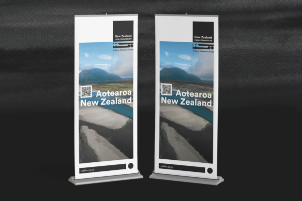 Two roll up banners on a black background.